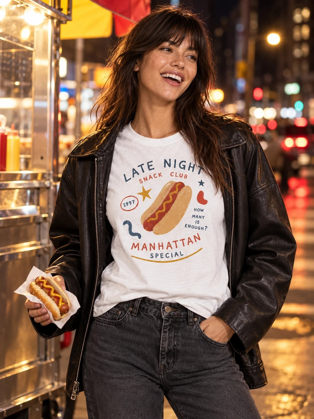 Woman at a New York hot dog cart at night in the Late Night Manhattan Special tee
